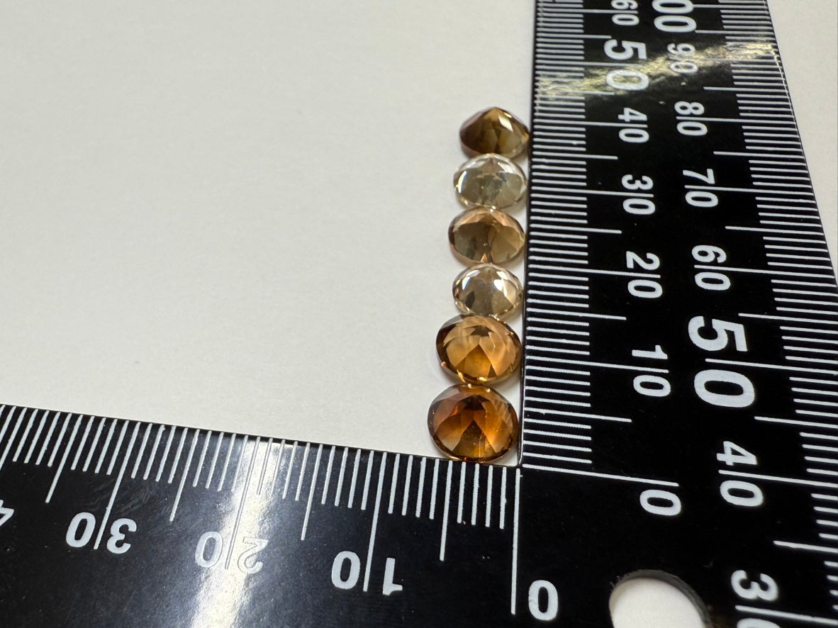 0020【ランダム発送】ラウンドファセットカット シャンパントパーズ 【1石あたり平均1.52ct】